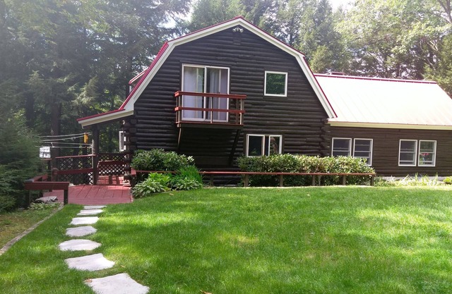 Waterfont log home nestled in the pines