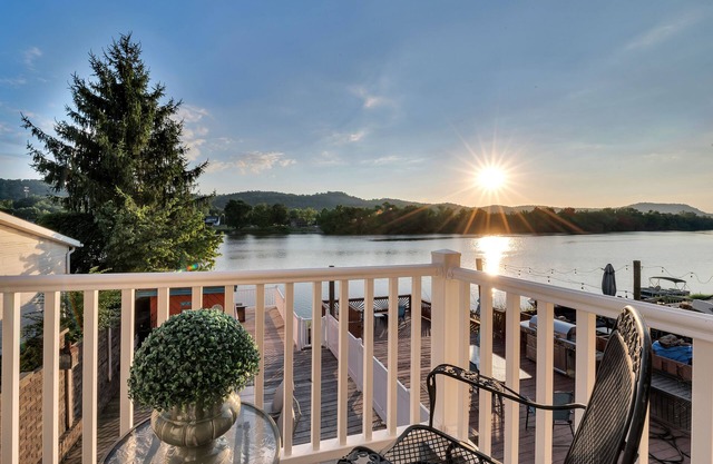 Waterfront condo with large decks and a dock for summer fun centrally located.