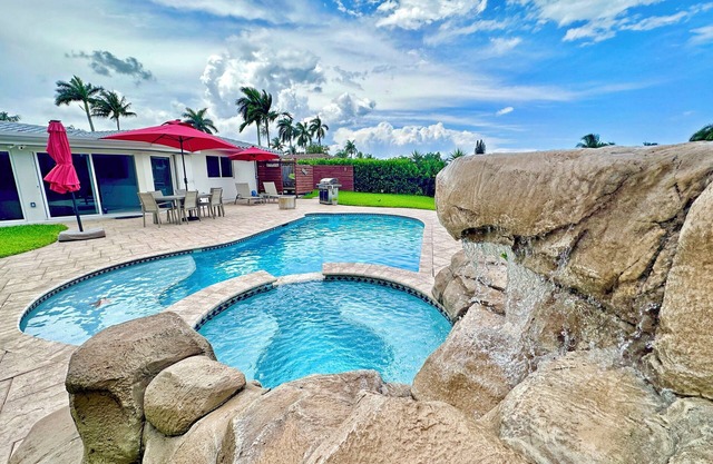 Waterfront home with private backyard. Heated pool with waterfall Jacuzzi