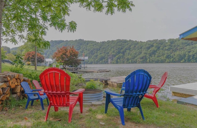 Waterfront retreat with private dock, wraparound deck & stunning lake views.