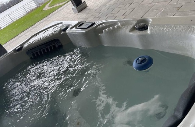 Waterfront unit with outdoor hot tub