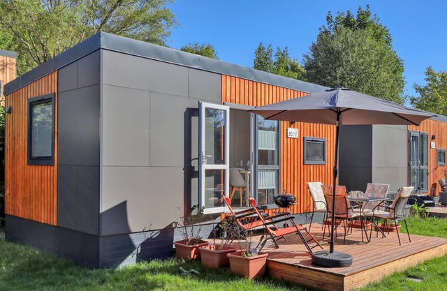 Welcome to this modern vacation home with panoramic views of the lake!