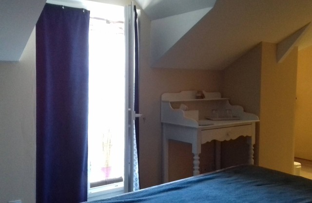 White room with private shower room and WC