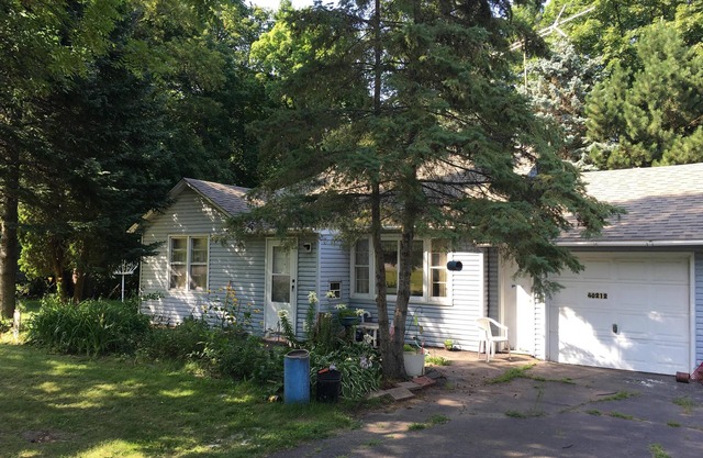 Wooded back yard with porch Randys rentals