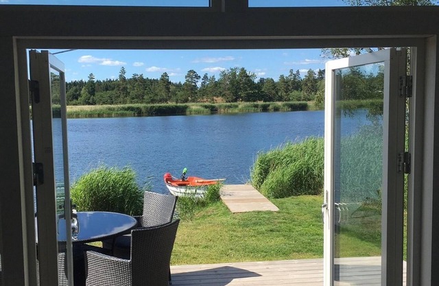Wooden holiday house, right by a bay