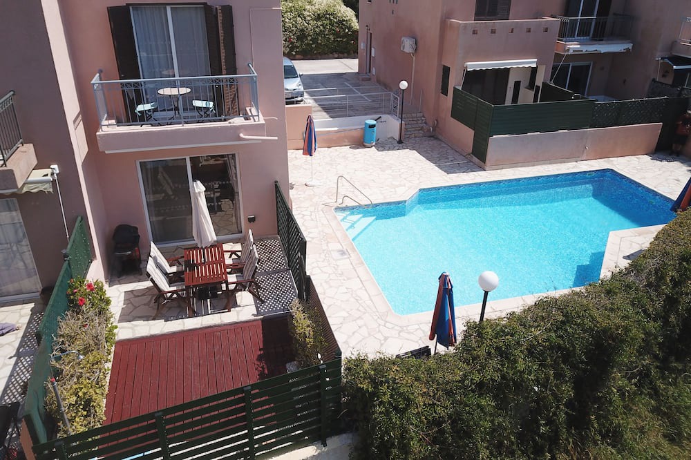 Peyia Town House | Direct access to the pool from the garden. A sandy beach is a few minutes away.