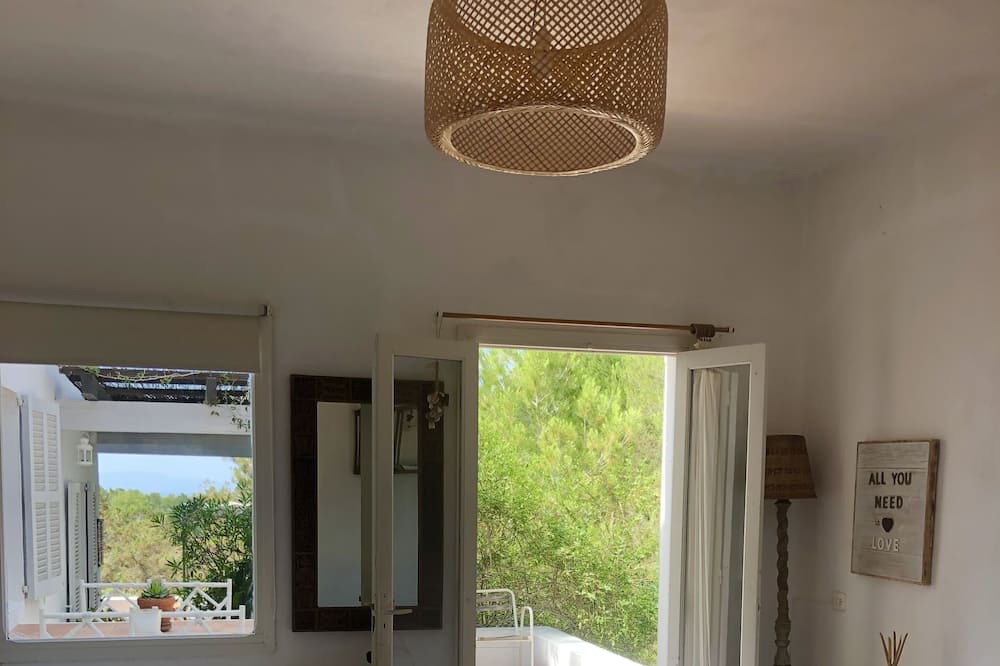 Es Cap de Barbaria House | Formentera. Room immersed in the woods with sea view.