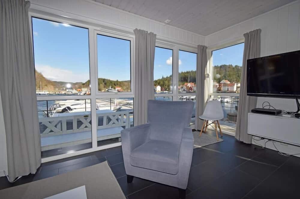 Lindesnes House | Holiday home 'Furuholmen Brygge 7', Furuholmen peninsula near Lindesnes, southern Norway, up to 7 people possible, e.g. 4 adults and 3-4 kids, 4 bedrooms, 2 shower-bathrooms, modern equipment, terrace and boat mooring in front of the house on the .