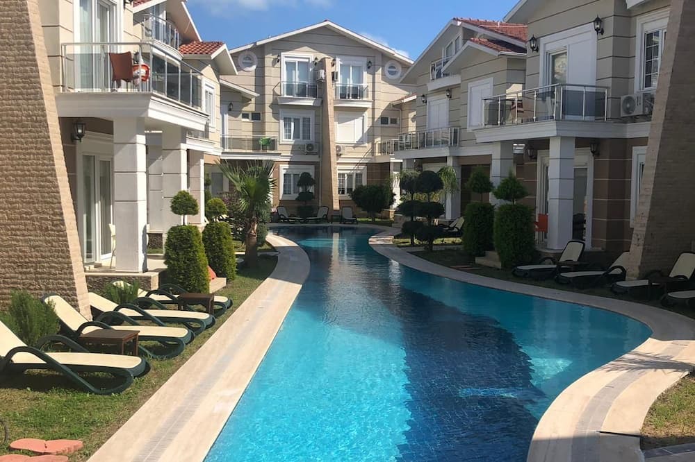 Belek Villa | A large swimming pool in a tranquil environment, offer a blend of comfort.