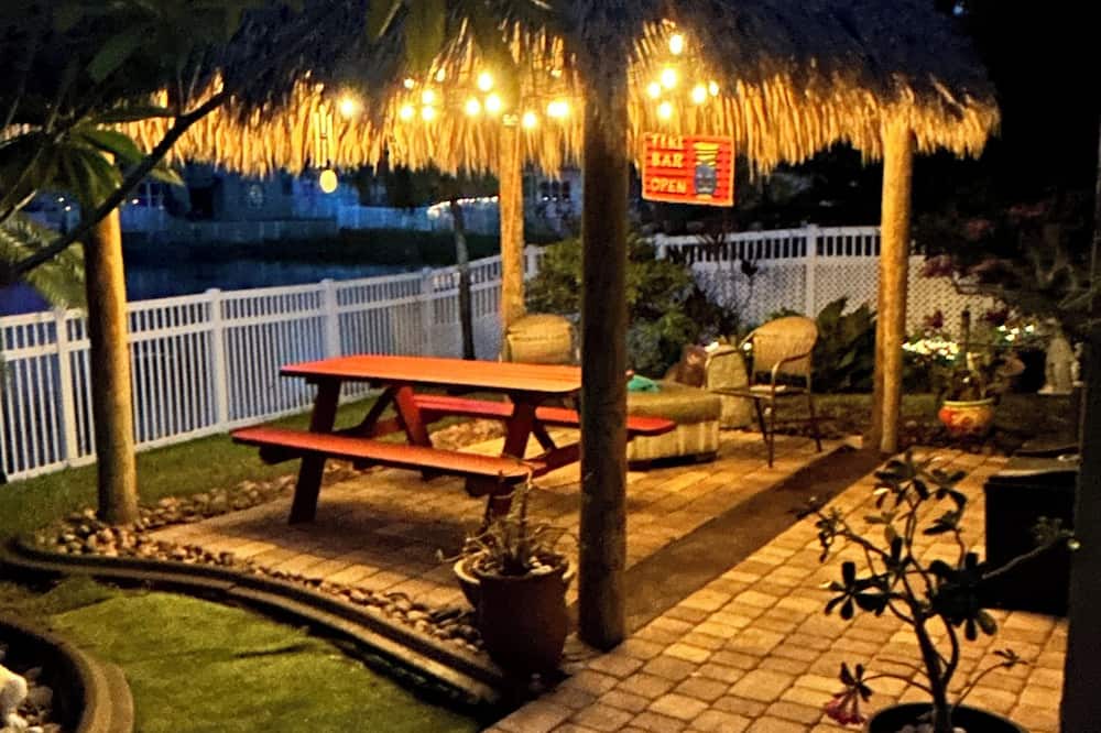 Miramar House | Beautiful lakefront retreat with outdoor kitchen, tiki hut and spa.