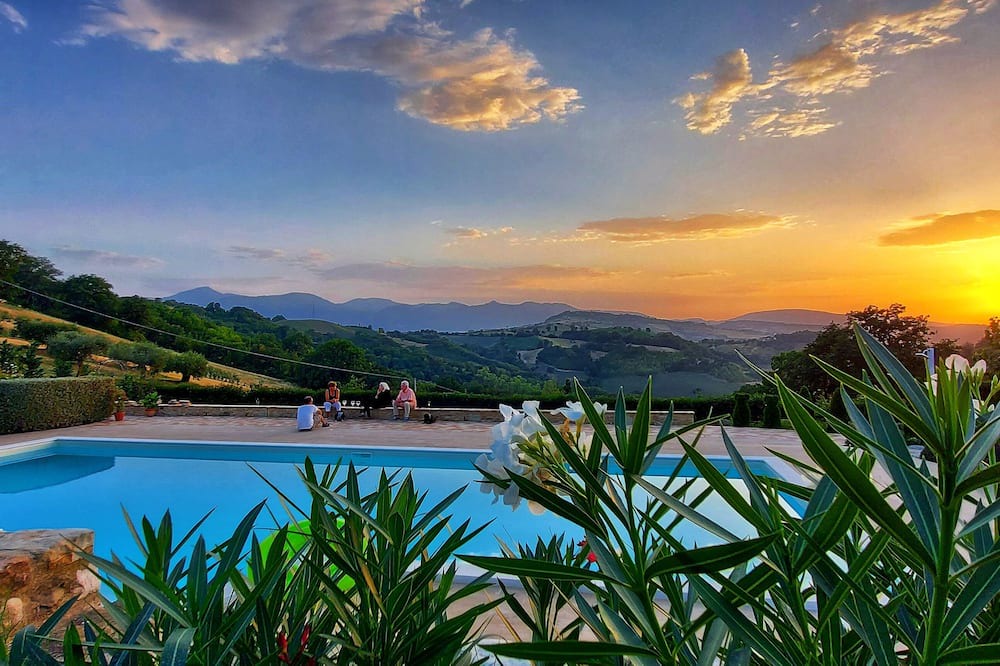 Penna San Giovanni House | San Isidore, a meticulously restored historic Italian home with a stunning pool.