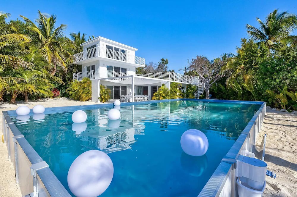 Rock Harbor Villa | Modern ocean side estate: 5 bed - 6 bath, big pool, 2 rooftops, small dock