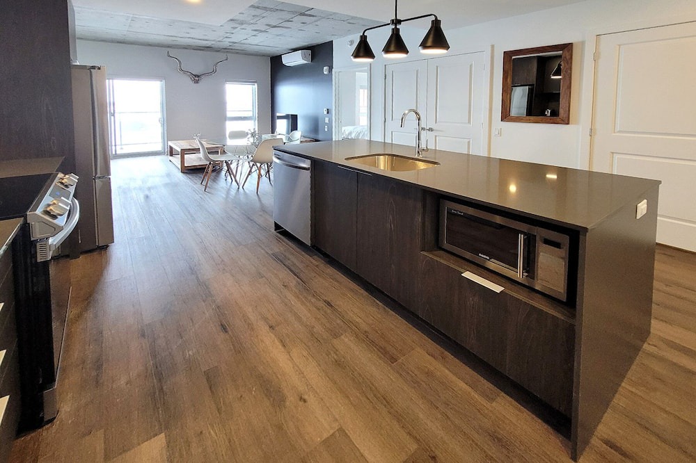 Fabreville Apartment | Corporate Stays -Relax & unwind with 1BR exclusive amenities with Rooftop Access