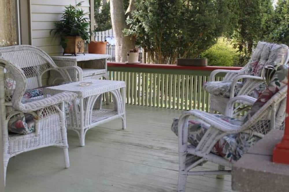 Onekama Apartment | Relax on deck next to the pool in this two room suite.