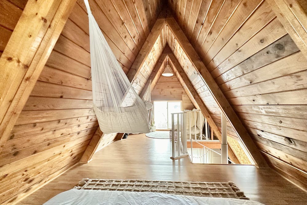 Division No. 10 Cabin | Techni Cabin offers a cozy A-frame blending rustic charm with modern comforts.