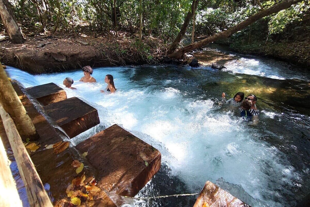 Pousada do Rio Quente Apartment | Resort Park Veredas with the warm river in the background