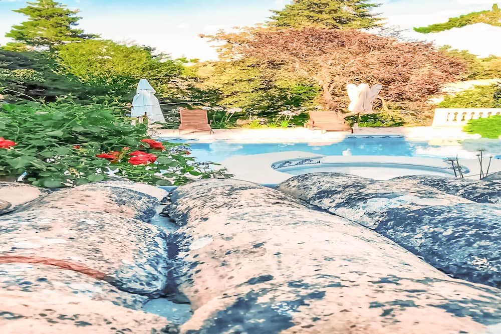 Laval-Pradel Apartment | Decorative and cozy vacation apartment with communal pool and idyllic garden.