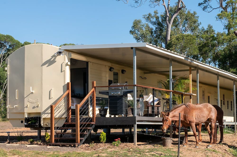 Barrine Cottage | Train Carriage in peaceful surrounds with mountain views on a farm.