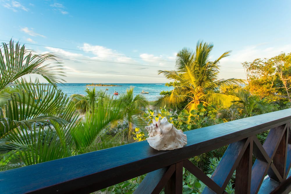 Island Harbour House | Exquisite 3 Bedroom villa. Unwind with beach views, and gentle island breezes.