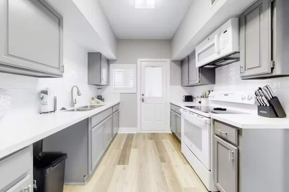 Galveston Cabin | Centrally located unit with shared courtyard, designated hot tub, & fire pit!