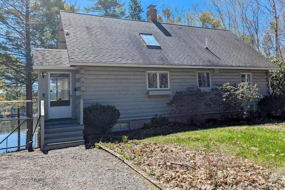 Wiscasset House | Charming riverfront home with cozy interiors, dock, and scenic deck views