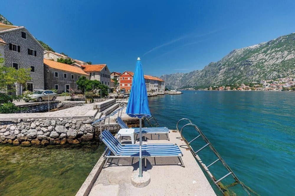 Kotor House | Historic waterfront house near Kotor with a private swimming pier