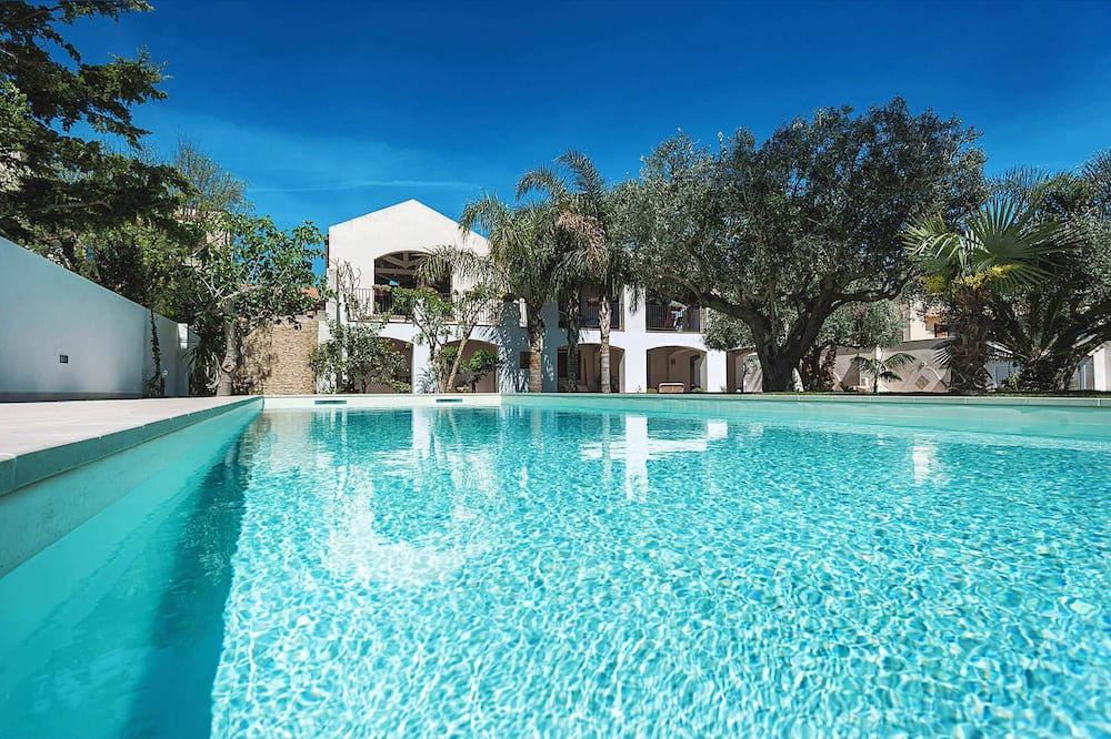 Marsala House | My Rental Homes - Casa Tika with shared pool surrounded by a wonderful garden