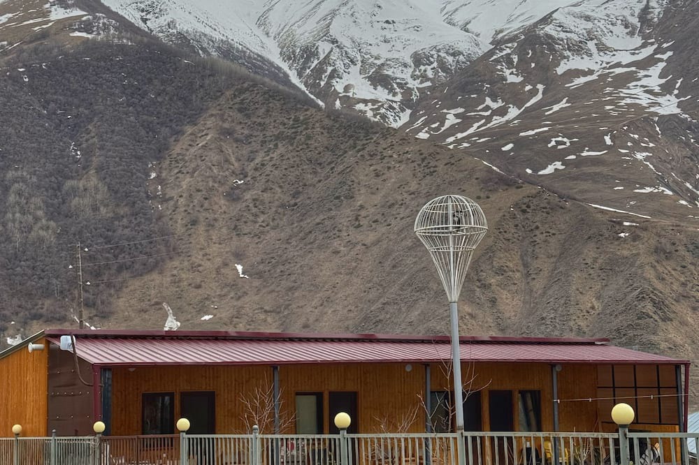 Kazbegi Apartment | A studio apartment at a secluded area by the river, surrounded by mountains.