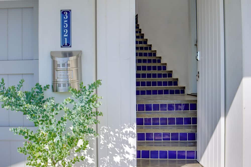 Middletown Cottage | MONTHLY Santorini-inspired Walk-out Cottage w/Private Patio, Fireplace + Jacuzzi