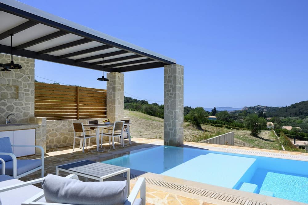 Kavvadades Villa | Lavish Corfu Villa | Villa Elysian View | 1 Bedroom | Spacious Furnished Terrace with Shaded Outdoor Dining Area | Private Garden, Pool and Hot Tub | Prime Location | Arillas, Mega Lithari