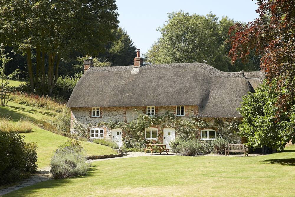 Ebbesborne Wake Cottage | This beautiful 300-year-old detached thatched cottage nestled within the stunning Cranborne Chase.