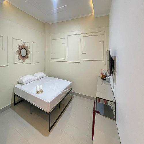 Karawang Timur Hotel | JM Tuparev Mitra RedDoorz