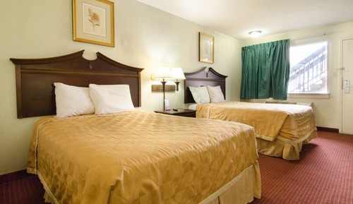 Room with Two Double Beds with Sofa Bed