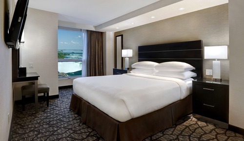 King Bed with Sofa Bed and partial view of Niagara Falls - Floors 10-25