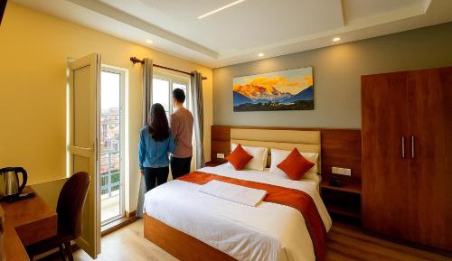 Deluxe King/Couple Room with Private Balcony and City & Mountain View