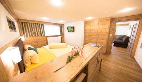 One-Bedroom Apartment in the Basement with Balcony and Garden View