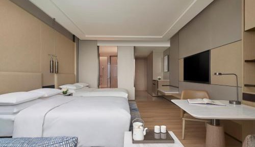 Superior guest room with 2 double bed, sofa bed and bay view