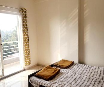 One-Bedroom Apartment with Balcony and City View
