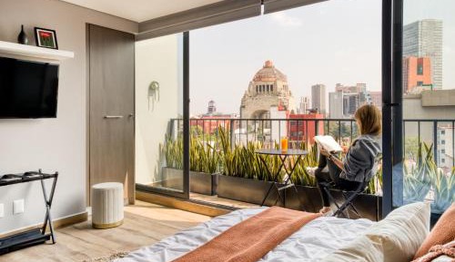 One-Bedroom Apartment with Balcony and City View