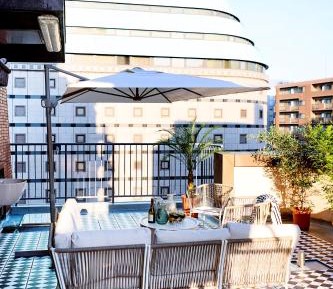 One-Bedroom Apartment with Balcony and City View