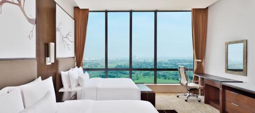 Club Twin Room with Lounge Access, 1 Way Airport Transfers, 20% F&B Discount & Happy Hours (1 + 1 IMFL - 4 pm to 8 pm at 31/32)