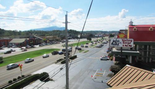 Superior Double Queen Room with Parkway View Shared Balcony with Rocking Chairs