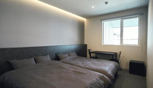 Twin Room with Private Bathroom - Non-Smoking