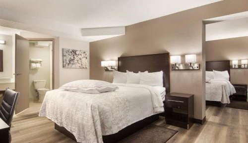 Premium Suite with Three Queen Beds with Kitchenette Smoke Free (Upgraded Bedding and Snack Box)