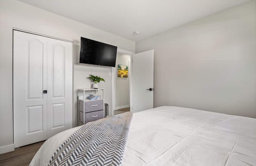 Northeast Edmonton House | Unique stay with retro arcade, free coffee/tea, and a spacious backyard patio