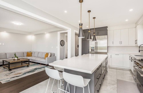 Brampton House | Luxury Six Bedroom home with main floor ensuite and spacious backyard.