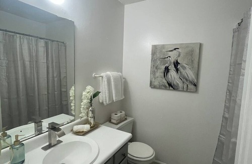 Greensboro House | Stylish Townhome Guest Room with Guest Bath