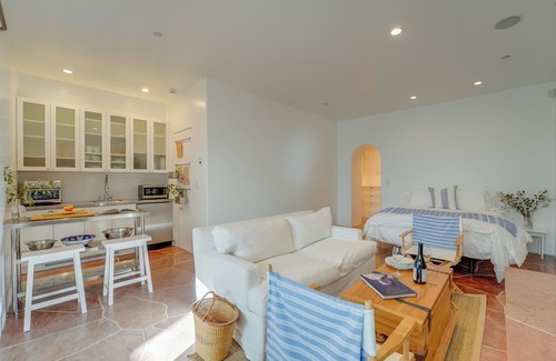 Middletown Cottage | MONTHLY Santorini-inspired Walk-out Cottage w/Private Patio, Fireplace + Jacuzzi