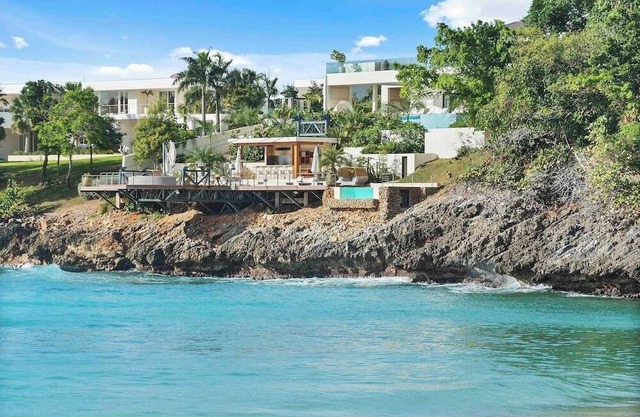 Gorgeous Beach House Perched Right Over the Ocean