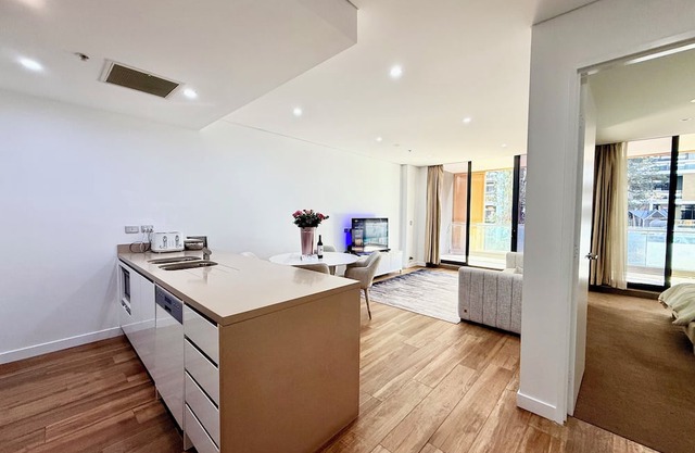 Near airport city 2 mins to train, cafes, stores w parking